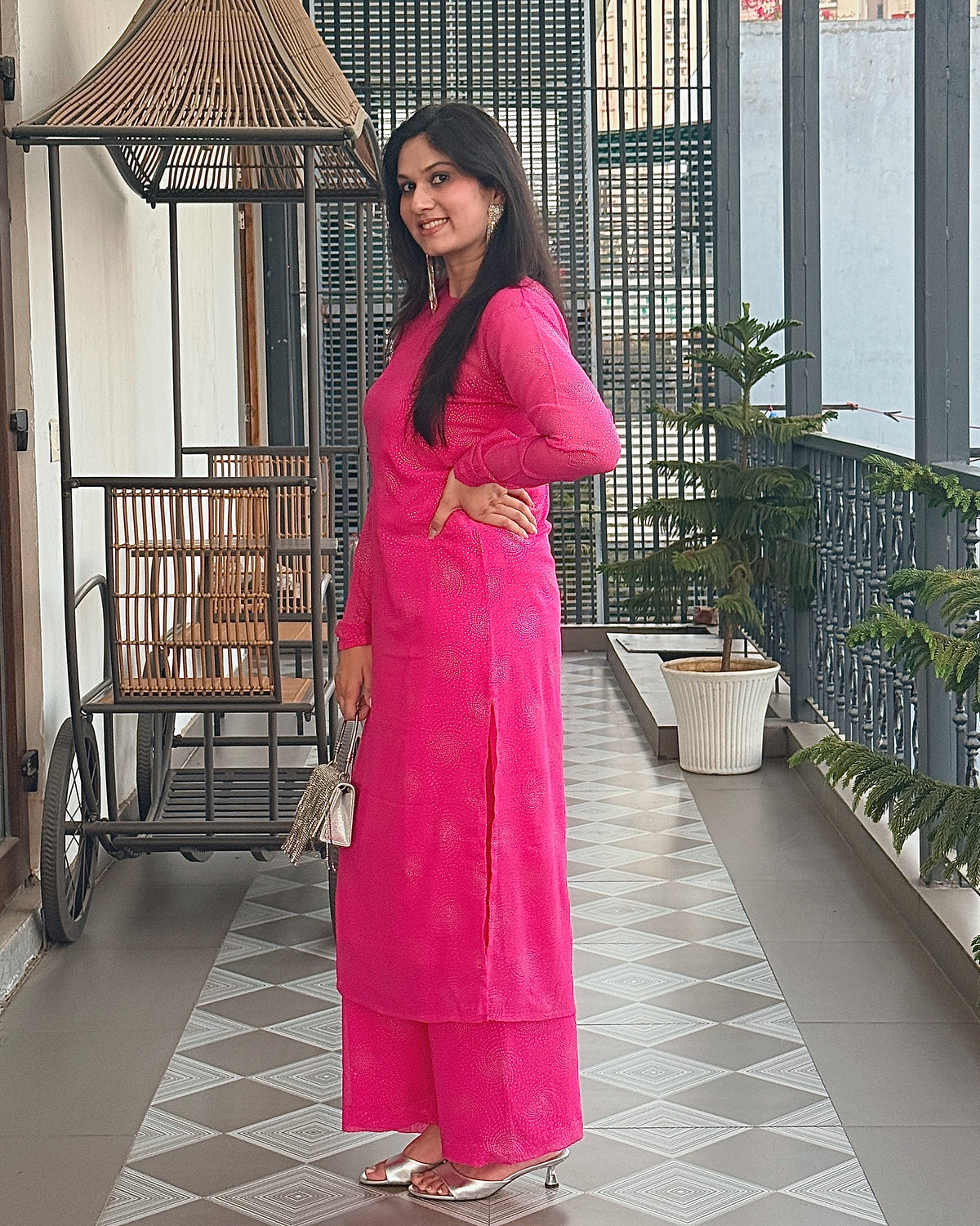Chandni Noor rani pink kurta and palazzo, side view